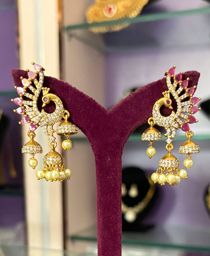 Buy Elegant Peacock Earrings with Dazzling White Stones and Matte Gold Shade online